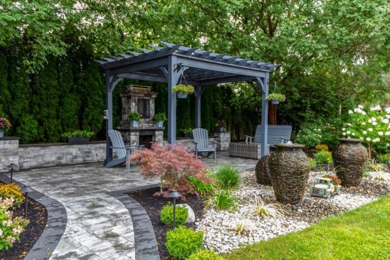 Large,Gray,Pergola,On,Pavers,With,Stone,Fireplace,And,Waterfall