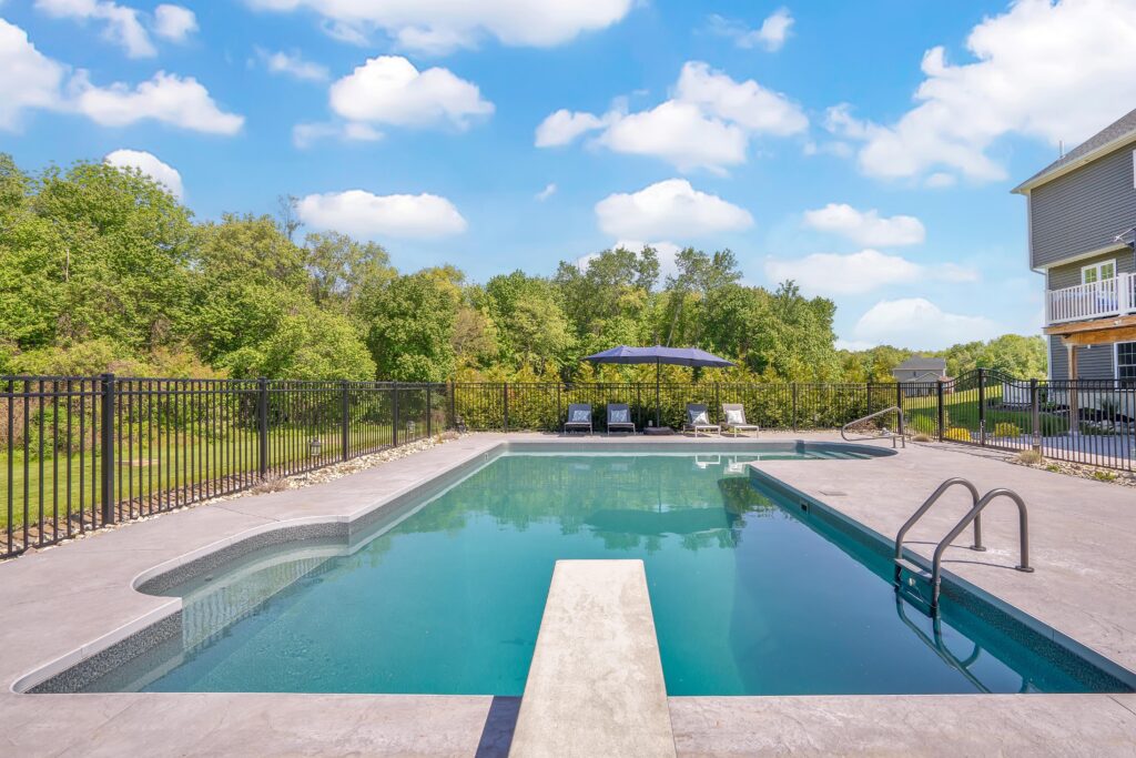 custom swimming pool contractor designing a backyard oasis
